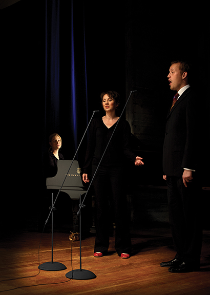 A stereo pair, such as these Sennheiser MKH 8000 condensers, placed out and in front of the singers, can work equally well for either a duet or larger vocal group.