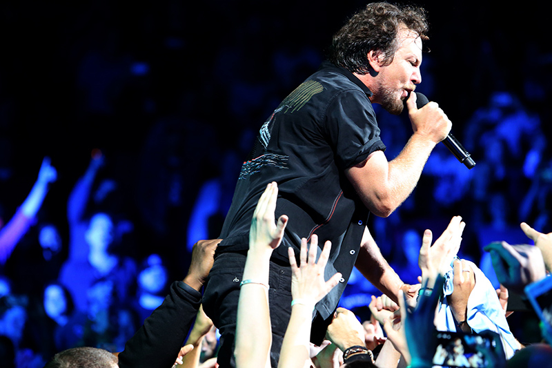 Vocalist Eddie Vedder getting in close and personal. Pearl Jam photo by Karen Loria