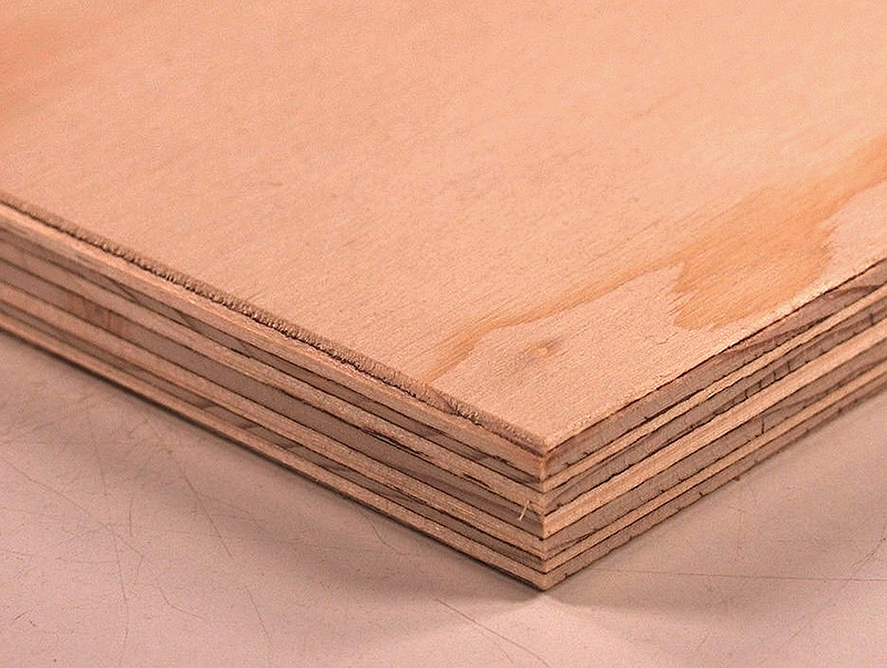 Fig. 1: Wood veneers are laid up in a series of alternating perpendicular layers to form the familiar end grain look of plywood.