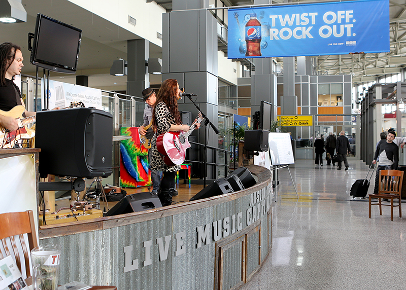 Singer-songwriter Wendy Colonna performing at the Austin-Bergstrom Airport in Texas.